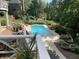 Stunning in-ground pool with a deck and beautiful landscaping at 10781 Cedar Ridge Ln, Brownsburg, IN 46278