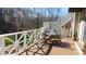 Deck with white railings, table, and chairs overlooking a backyard at 10781 Cedar Ridge Ln, Brownsburg, IN 46278