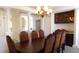 Formal dining room with a large table, chandelier, and built-in cabinetry at 10781 Cedar Ridge Ln, Brownsburg, IN 46278
