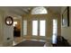 Bright entryway with double doors, a large window, and tile flooring at 10781 Cedar Ridge Ln, Brownsburg, IN 46278
