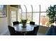 Breakfast nook with round table, window view, and access to backyard at 10781 Cedar Ridge Ln, Brownsburg, IN 46278