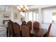 Formal dining room with a large table, chandelier, and views to living room at 10781 Cedar Ridge Ln, Brownsburg, IN 46278