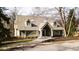 Tan brick home with dormer windows and landscaping at 10781 Cedar Ridge Ln, Brownsburg, IN 46278