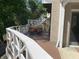 Deck with white railings, a table and chairs, and wooded backdrop at 10781 Cedar Ridge Ln, Brownsburg, IN 46278