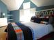 Blue bedroom with a bed, window, and built-in shelves at 10781 Cedar Ridge Ln, Brownsburg, IN 46278
