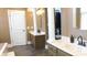 Elegant bathroom with double vanities, large mirror, and walk-in closet at 10781 Cedar Ridge Ln, Brownsburg, IN 46278