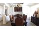 Formal dining room with a large table, chandelier, and built-in cabinetry at 10781 Cedar Ridge Ln, Brownsburg, IN 46278