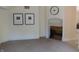 Living room with a fireplace and large windows offering natural light at 10781 Cedar Ridge Ln, Brownsburg, IN 46278