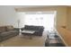 Bright living room with two sofas, a coffee table, and access to a kitchen at 10781 Cedar Ridge Ln, Brownsburg, IN 46278