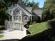 Tan brick house with gray roof, columns, and landscaping at 10781 Cedar Ridge Ln, Brownsburg, IN 46278