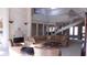 Two-story living room features a cozy sitting area and fireplace at 10781 Cedar Ridge Ln, Brownsburg, IN 46278