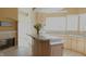 Kitchen features a large island and light-colored cabinetry at 10781 Cedar Ridge Ln, Brownsburg, IN 46278