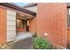 Brick entryway with a charming brown door and small porch at 9263 Golden Oaks W, Indianapolis, IN 46260