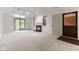 Spacious living room with fireplace and patio access at 9263 Golden Oaks W, Indianapolis, IN 46260