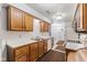 Bright kitchen features ample wood cabinetry and modern appliances at 9263 Golden Oaks W, Indianapolis, IN 46260