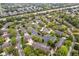 Community overview featuring a pond, mature trees, and houses at 9263 Golden Oaks W, Indianapolis, IN 46260