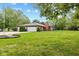Brick ranch home with attached two-car garage and spacious lawn at 9263 Golden Oaks W, Indianapolis, IN 46260