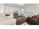 Finished basement with sofas, chairs and a TV at 9263 Golden Oaks W, Indianapolis, IN 46260