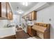Efficient kitchen with wood cabinets and white appliances at 9263 Golden Oaks W, Indianapolis, IN 46260
