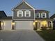 Two-story gray house with white shutters, two-car garage, and landscaping at 1130 Cobra Dr, Franklin, IN 46131