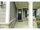 Covered front porch with rocking chair and bench at 6390 Torrington St, Brownsburg, IN 46112