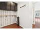 Laundry area with black cabinets and geometric patterned wall at 3041 N Park Ave, Indianapolis, IN 46205