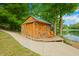 Wooden lakefront shed with deck and seating at 3958 E Edgewood Cir, Martinsville, IN 46151