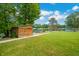 Spacious grassy yard with lake access and storage shed at 3958 E Edgewood Cir, Martinsville, IN 46151