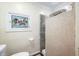Bathroom with decorative tile shower and stained glass window at 3958 E Edgewood Cir, Martinsville, IN 46151