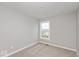 Unfurnished bedroom with neutral gray walls, a single window, and plush carpeting at 7306 W County Road 600 Rd # 14-602, McCordsville, IN 46055