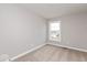 Unfurnished bedroom with single window, neutral gray walls, and plush carpet at 7306 W County Road 600 Rd # 14-602, McCordsville, IN 46055