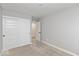 Empty bedroom with white closet doors, gray walls, and plush carpeting at 7306 W County Road 600 Rd # 14-602, McCordsville, IN 46055