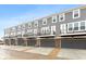 Row of townhouses with balconies and garages at 7306 W County Road 600 Rd # 14-602, McCordsville, IN 46055