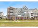 Modern townhouses with a mix of colors, showcasing curb appeal at 7306 W County Road 600 Rd # 14-602, McCordsville, IN 46055
