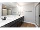 Modern bathroom with dark wood double vanity, glass shower, and tile at 7310 W County Road 600 Rd # 14-603, McCordsville, IN 46055