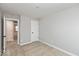Unfurnished bedroom with carpeted floors, simple white walls, and open door to another room at 7310 W County Road 600 Rd # 14-603, McCordsville, IN 46055