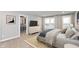 Spacious bedroom with a large bed, walk-in closet, and TV at 7310 W County Road 600 Rd # 14-603, McCordsville, IN 46055