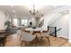 Bright dining area with a round table and chairs, near staircase at 7310 W County Road 600 Rd # 14-603, McCordsville, IN 46055