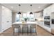 Modern kitchen with white cabinets, island, and stainless steel appliances at 7310 W County Road 600 Rd # 14-603, McCordsville, IN 46055