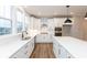 Spacious white kitchen with an island, modern appliances, and stylish black accents at 7310 W County Road 600 Rd # 14-603, McCordsville, IN 46055