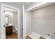 Laundry room with washer and dryer hookups, and adjacent bathroom at 7310 W County Road 600 Rd # 14-603, McCordsville, IN 46055