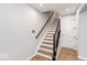 Stairway with wood treads and modern black railing at 7310 W County Road 600 Rd # 14-603, McCordsville, IN 46055