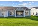 Home's exterior showcasing a backyard and patio at 10618 Maidenhair Dr, Indianapolis, IN 46239