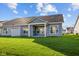 Home's exterior showcasing a backyard and patio at 10618 Maidenhair Dr, Indianapolis, IN 46239