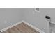 Unfinished basement corner with wood flooring at 10618 Maidenhair Dr, Indianapolis, IN 46239