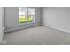 Bright bedroom featuring grey carpet and window at 10618 Maidenhair Dr, Indianapolis, IN 46239