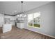 Modern kitchen features white cabinets, stainless steel appliances, and a kitchen island at 10618 Maidenhair Dr, Indianapolis, IN 46239