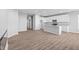 Modern kitchen with white cabinets, an island, and stainless steel appliances at 10618 Maidenhair Dr, Indianapolis, IN 46239