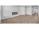Living room with hardwood floors and a modern fireplace at 10618 Maidenhair Dr, Indianapolis, IN 46239
