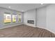 Spacious living room with hardwood floors and a modern fireplace at 10618 Maidenhair Dr, Indianapolis, IN 46239